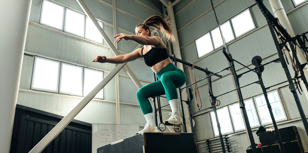 An athlete mid box jump